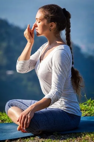 Breathing exercise demonstration in morning light